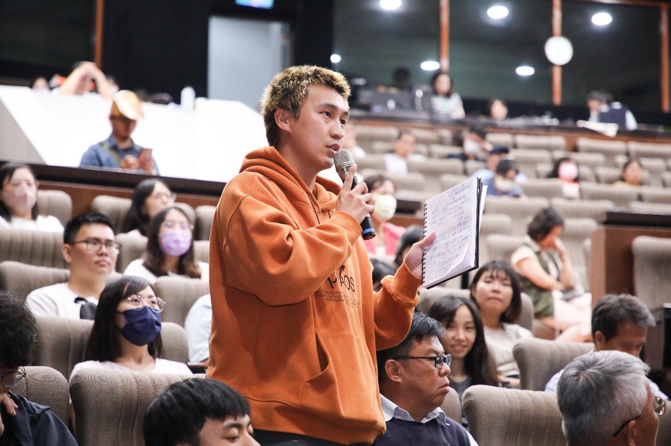 Participants raise questions during the session.